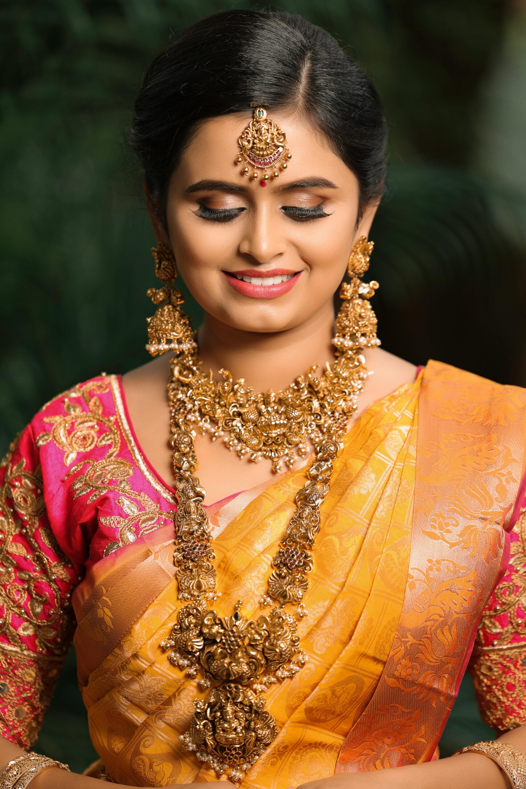Home Beautiful Indian bride in colorful saree and traditional jewelry, smiling gracefully.